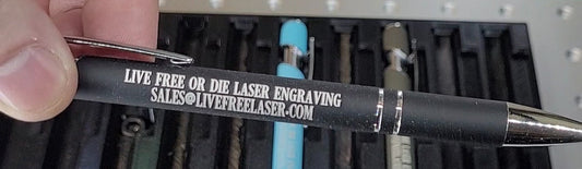 Close up of laser engraving on pen barrel