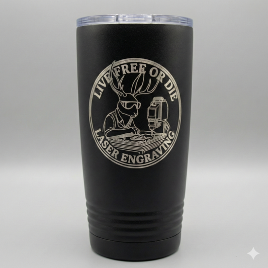 Black tumbler with laser engraved design on a gray background