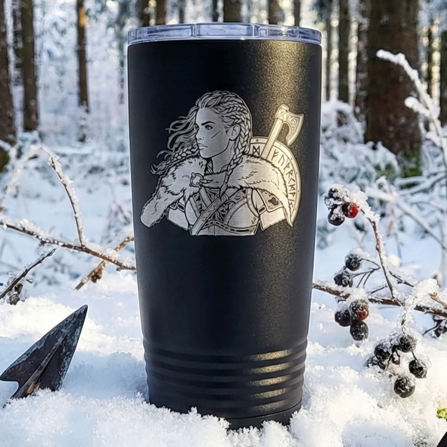Laser engraved black tumbler featuring Viking Shieldmaiden with battle axe and runic shield in snow